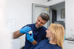 dentist explaining dental crowns in Charlotte, NC