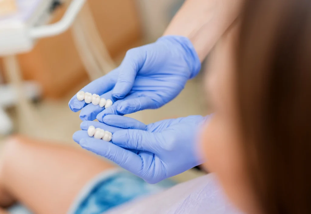 dentist showing patient dental crowns in Charlotte