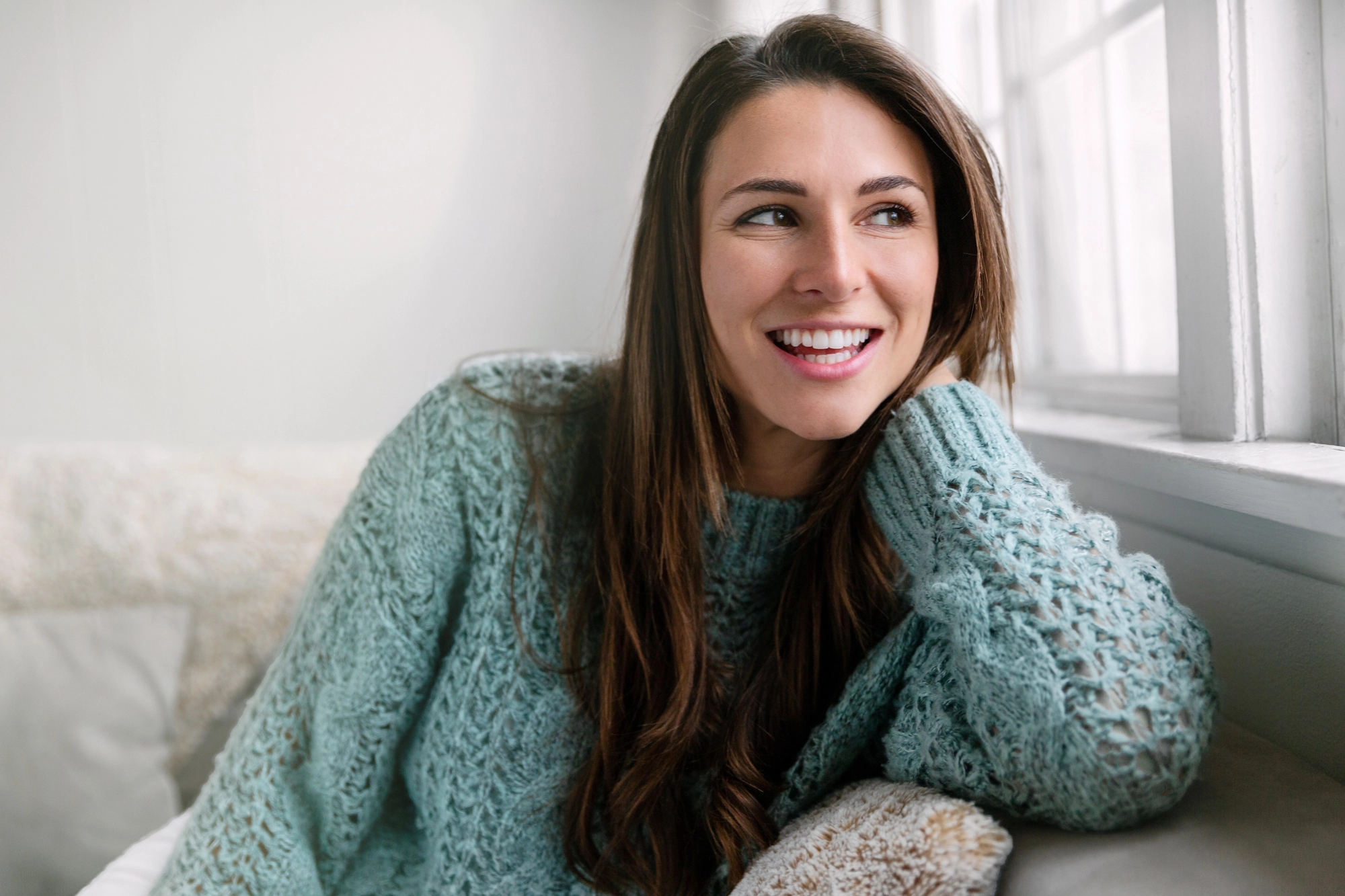 happy woman after getting dental bridges in Charlotte