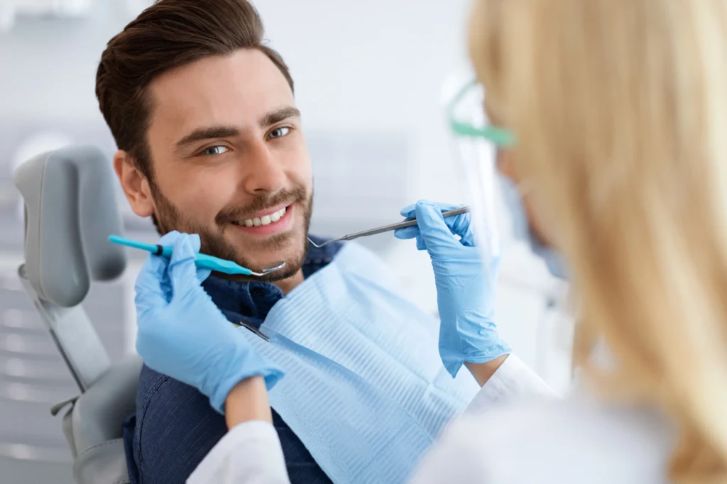 man at the dentist discussing teeth whitening in South End Charlotte