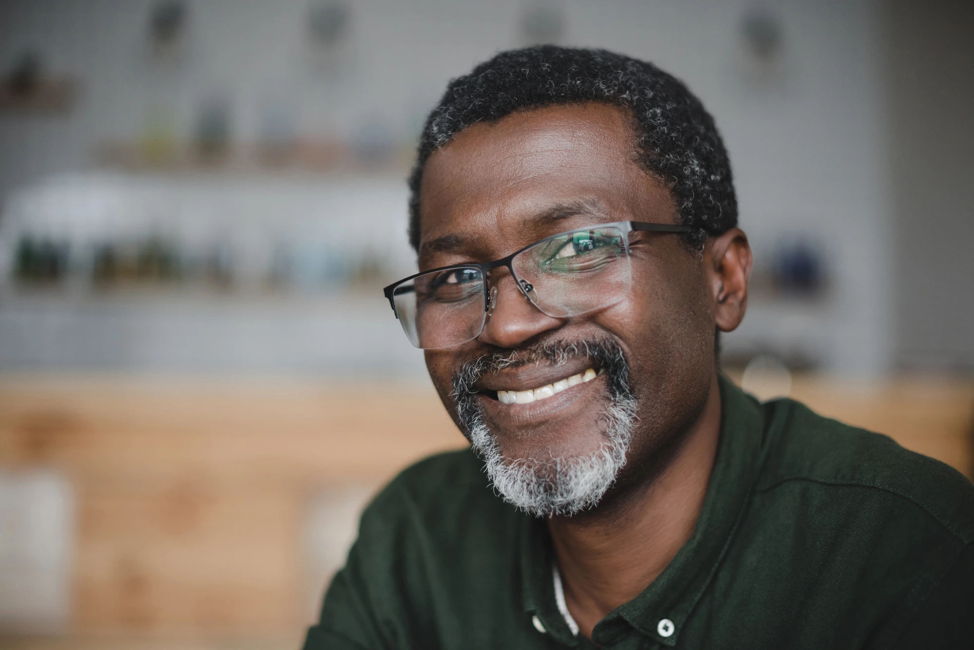 man happy after going to cosmetic dentists in Park Road, NC