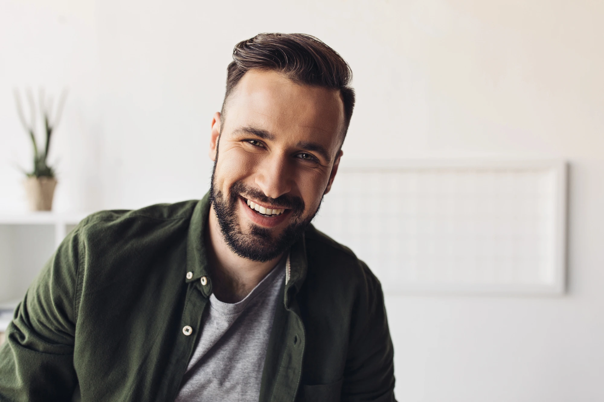 man smiling after getting dental bridges in Charlotte, NC