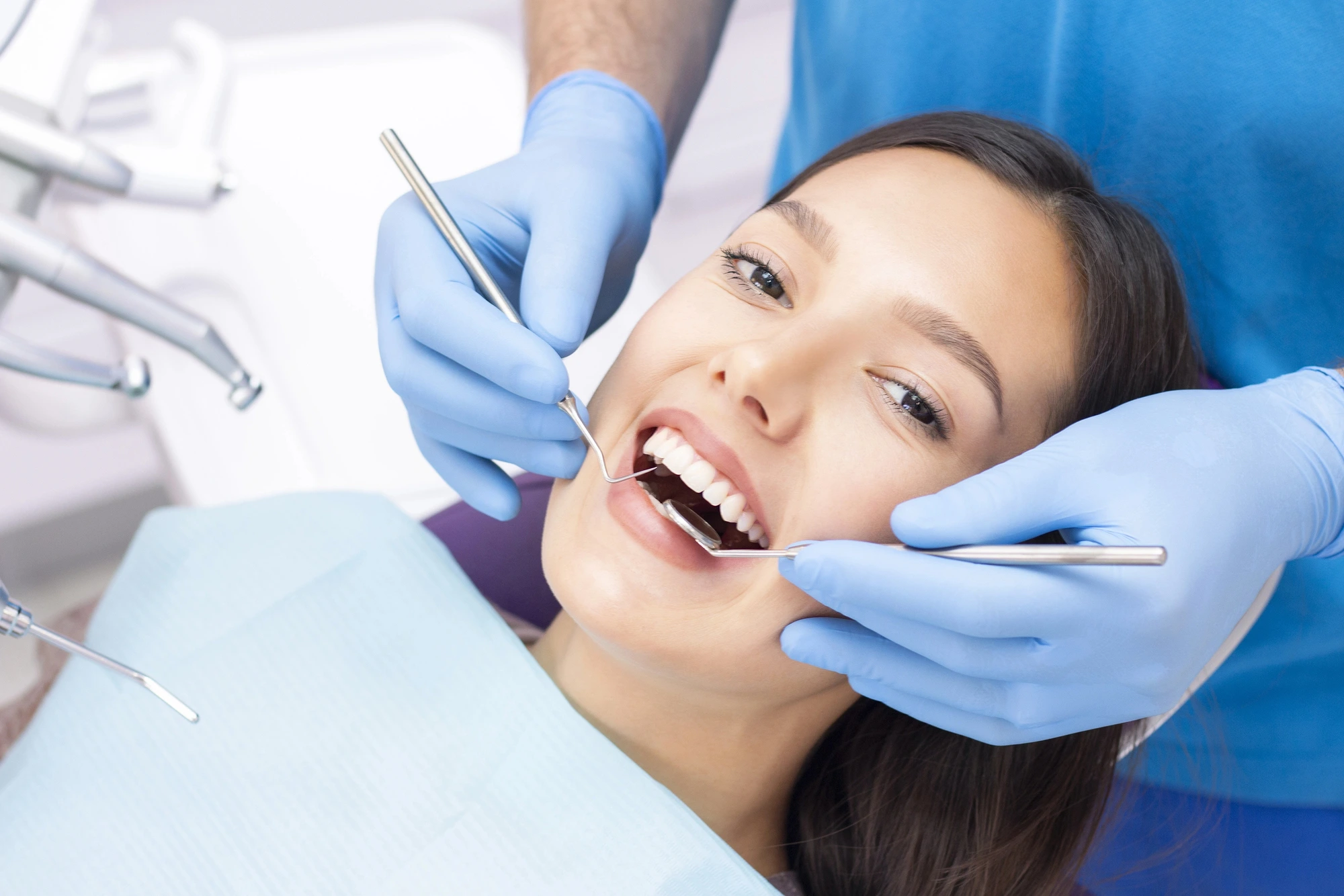 smiling woman at the dentist getting veneers in South Charlotte