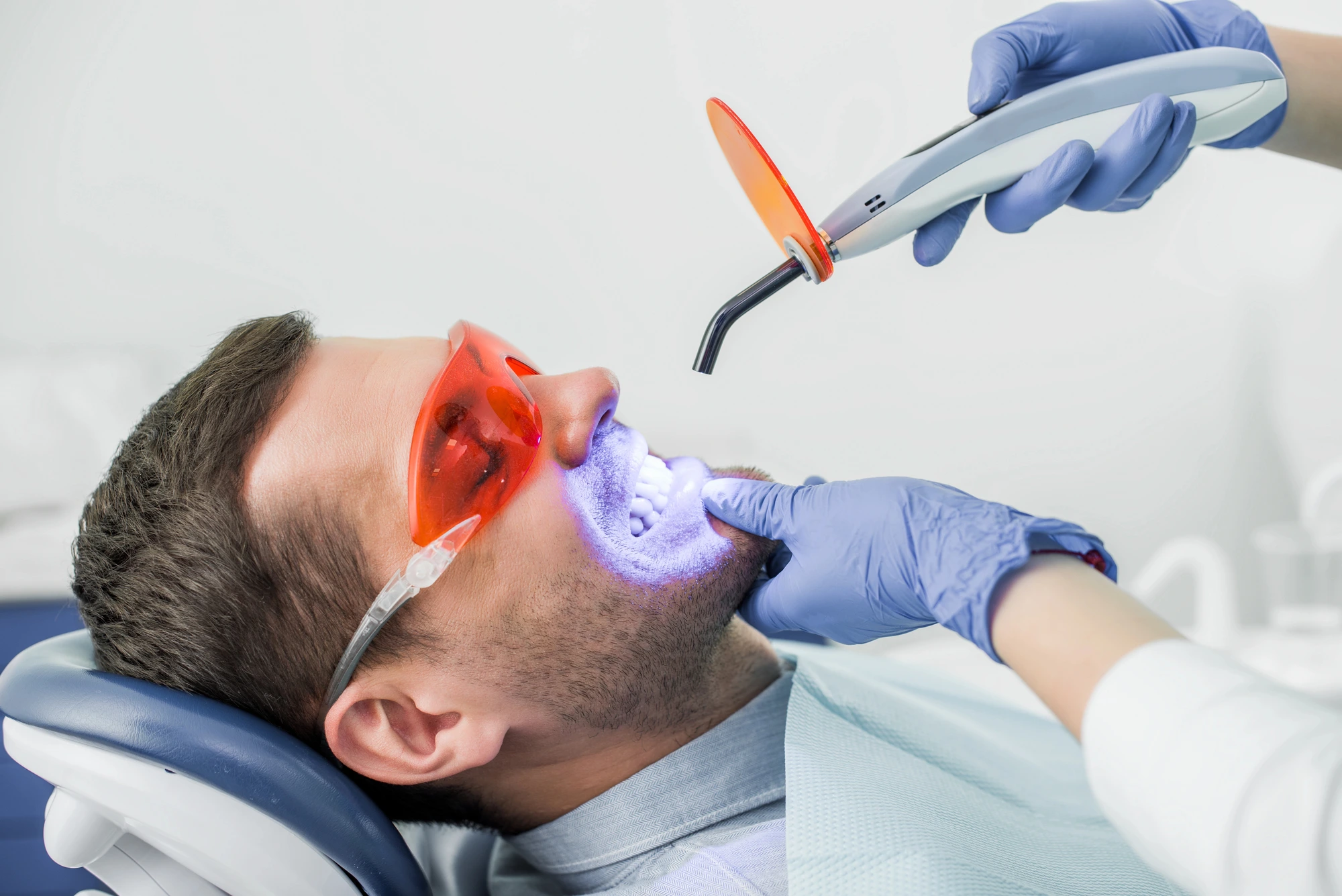man geeting professional teeth whitening in South Charlotte