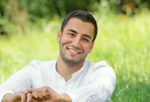 man happy after getting porcelain veneers near me