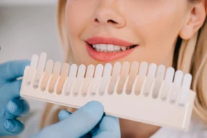 woman deciding teeth color for teeth whitening in Uptown Charlotte