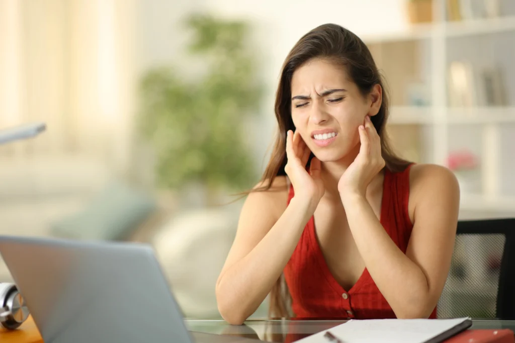 woman in pain before Botox for TMJ in Charlotte