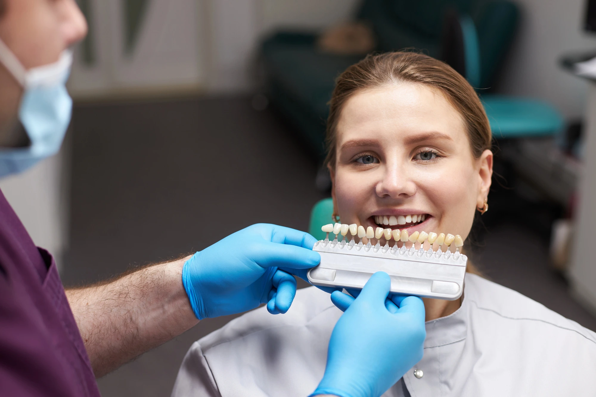 woman trying porcelain veneers near me